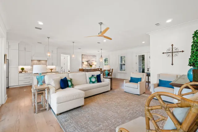 a bedroom with a large bed a flat tv screen and a balcony