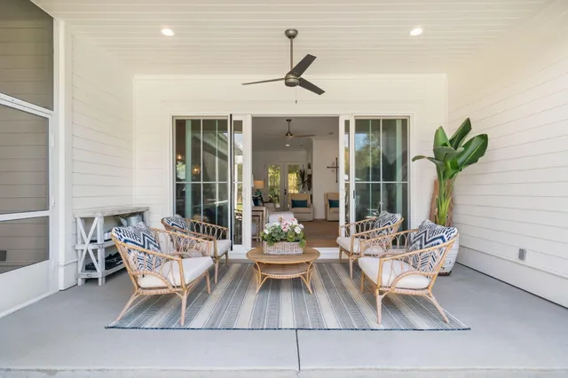 an aerial view of a house with swimming pool and a yard