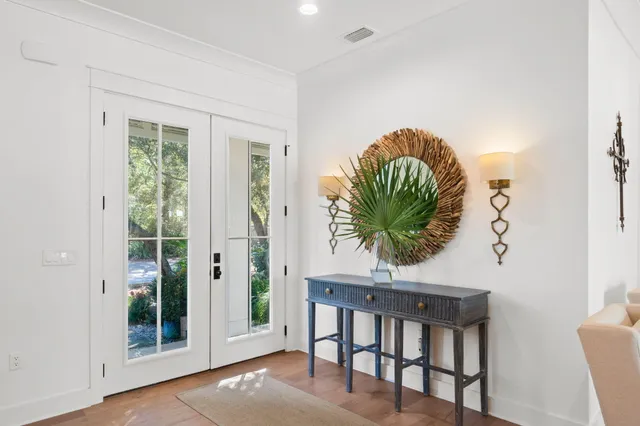 a kitchen with kitchen island granite countertop a sink cabinets and stainless steel appliances