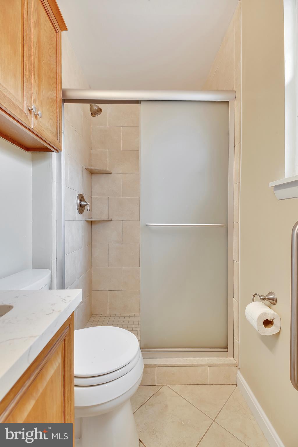 205 Burns Crossing Road Severn, MD 21144 - Photo 14 of 30 a bathroom with a shower and a toilet