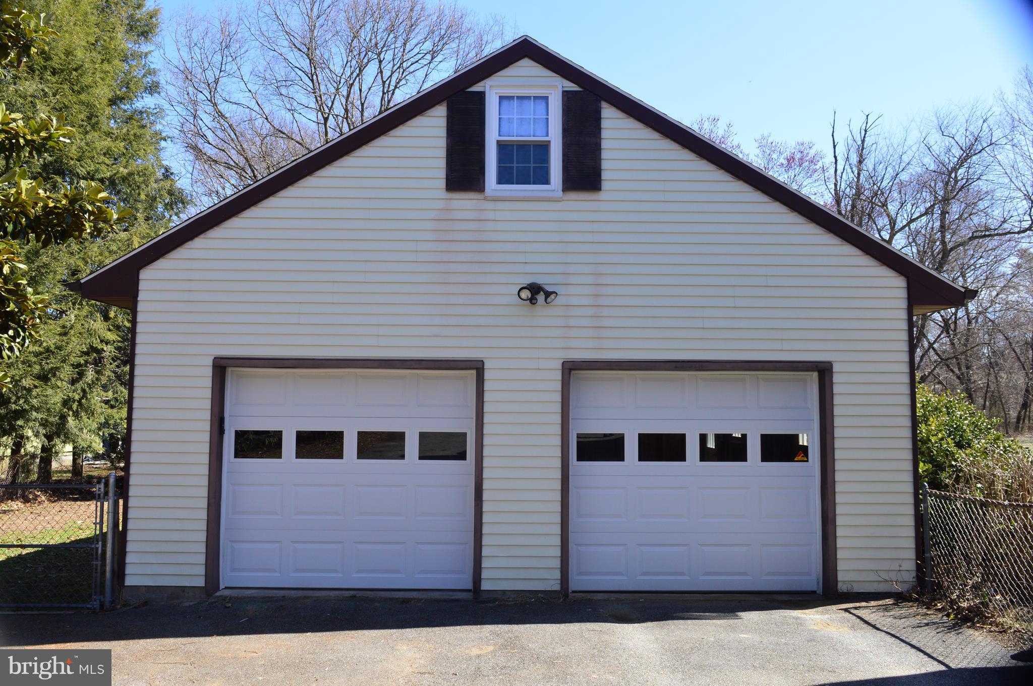 205 Burns Crossing Road Severn, MD 21144 - Photo 26 of 30 a front view of a house with a garage