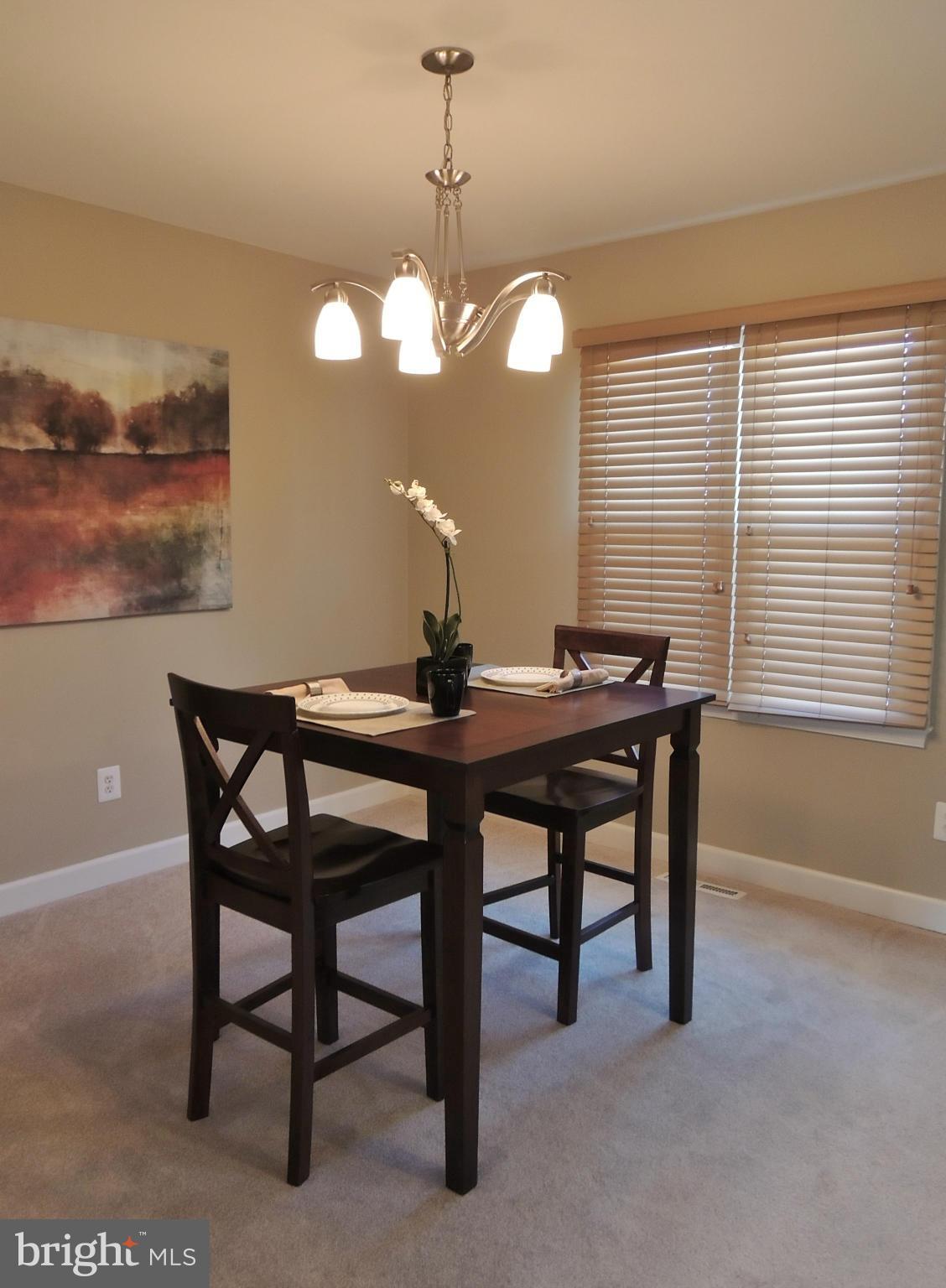 4803 Ebenezer Road Nottingham, MD 21236 - Photo 20 of 29 a view of a dining room with furniture and chandelier