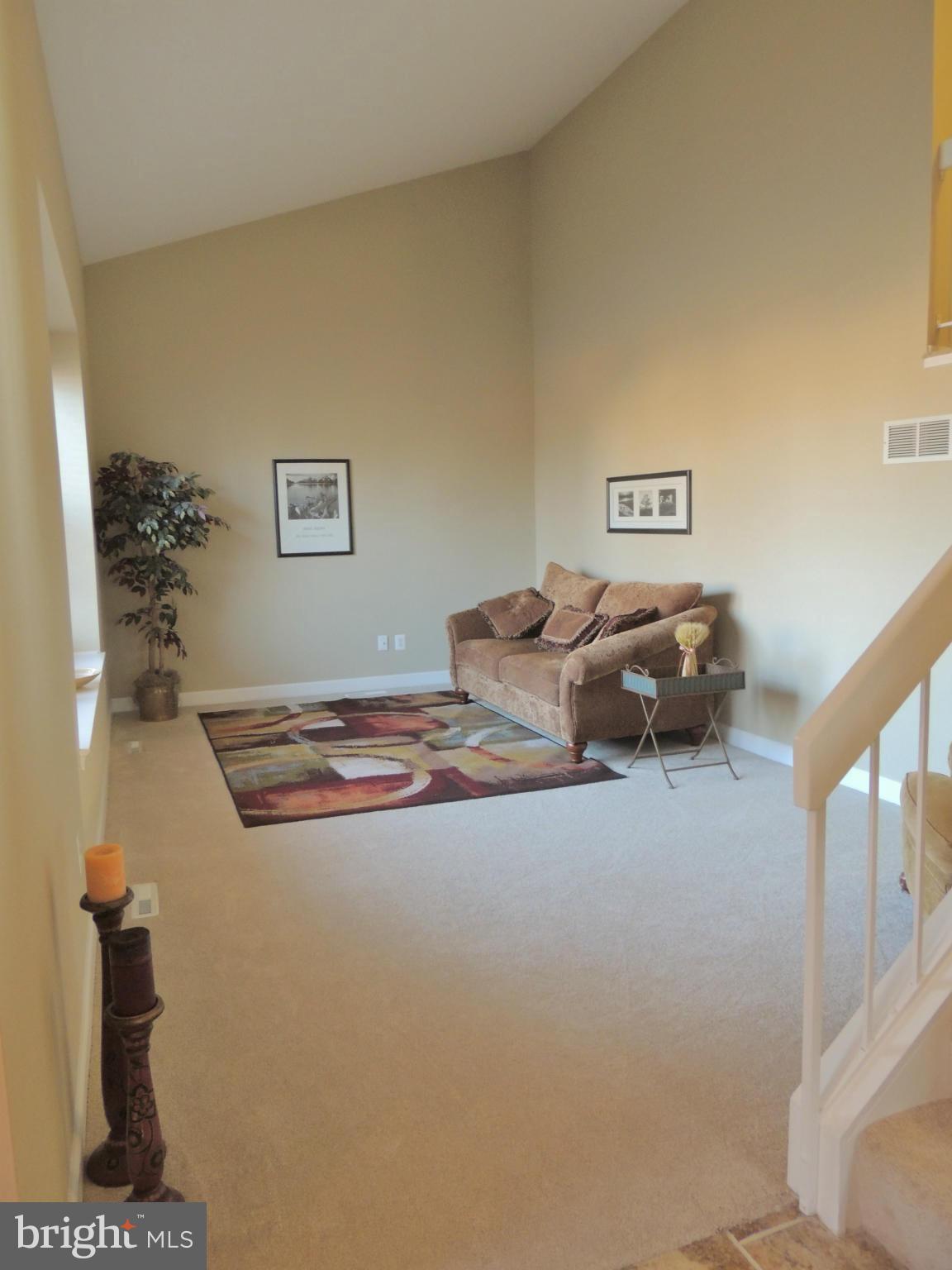 4803 Ebenezer Road Nottingham, MD 21236 - Photo 22 of 29 a bedroom with a bed and a lamp on table