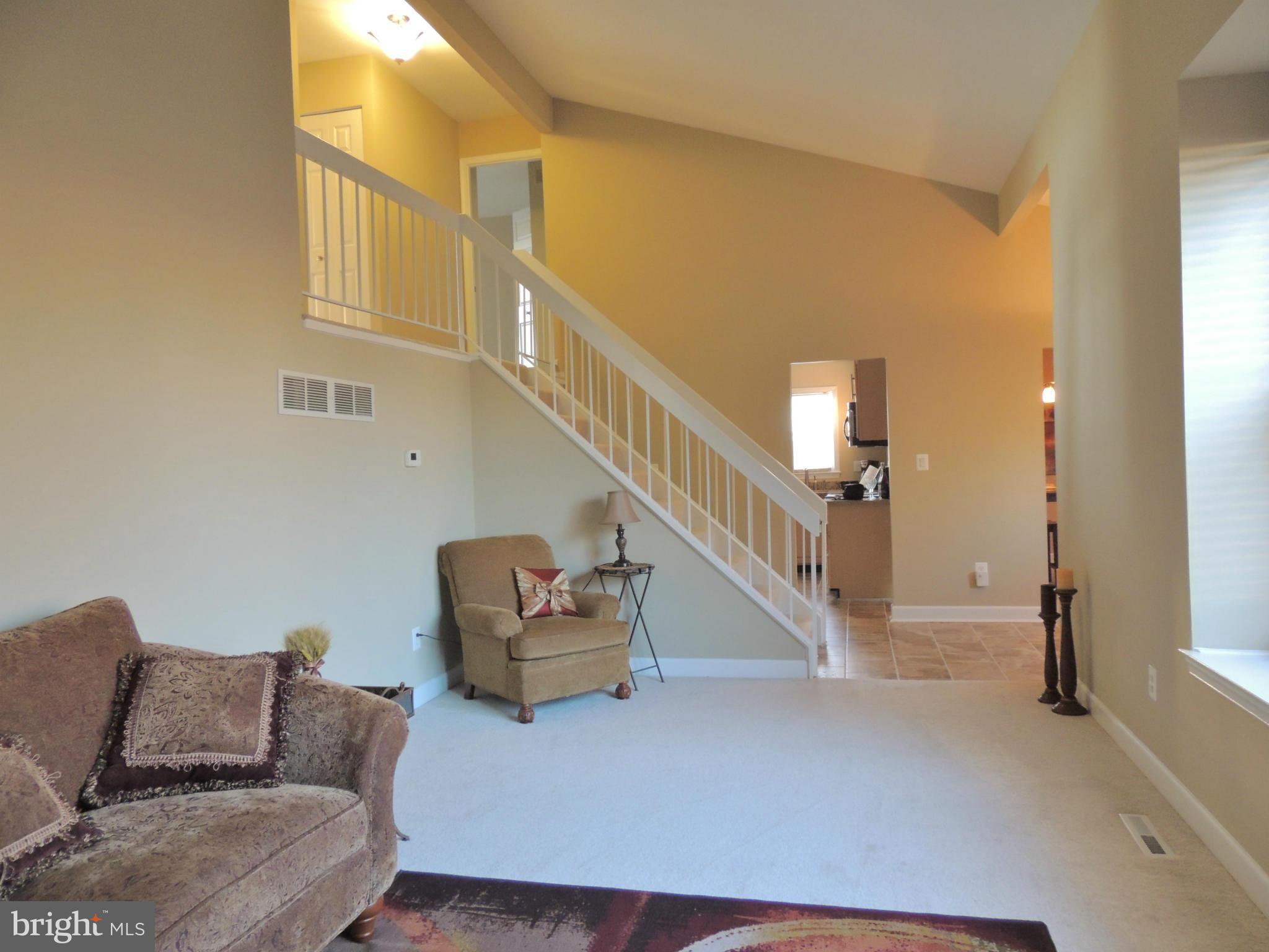 4803 Ebenezer Road Nottingham, MD 21236 - Photo 23 of 29 a living room with furniture and stairs