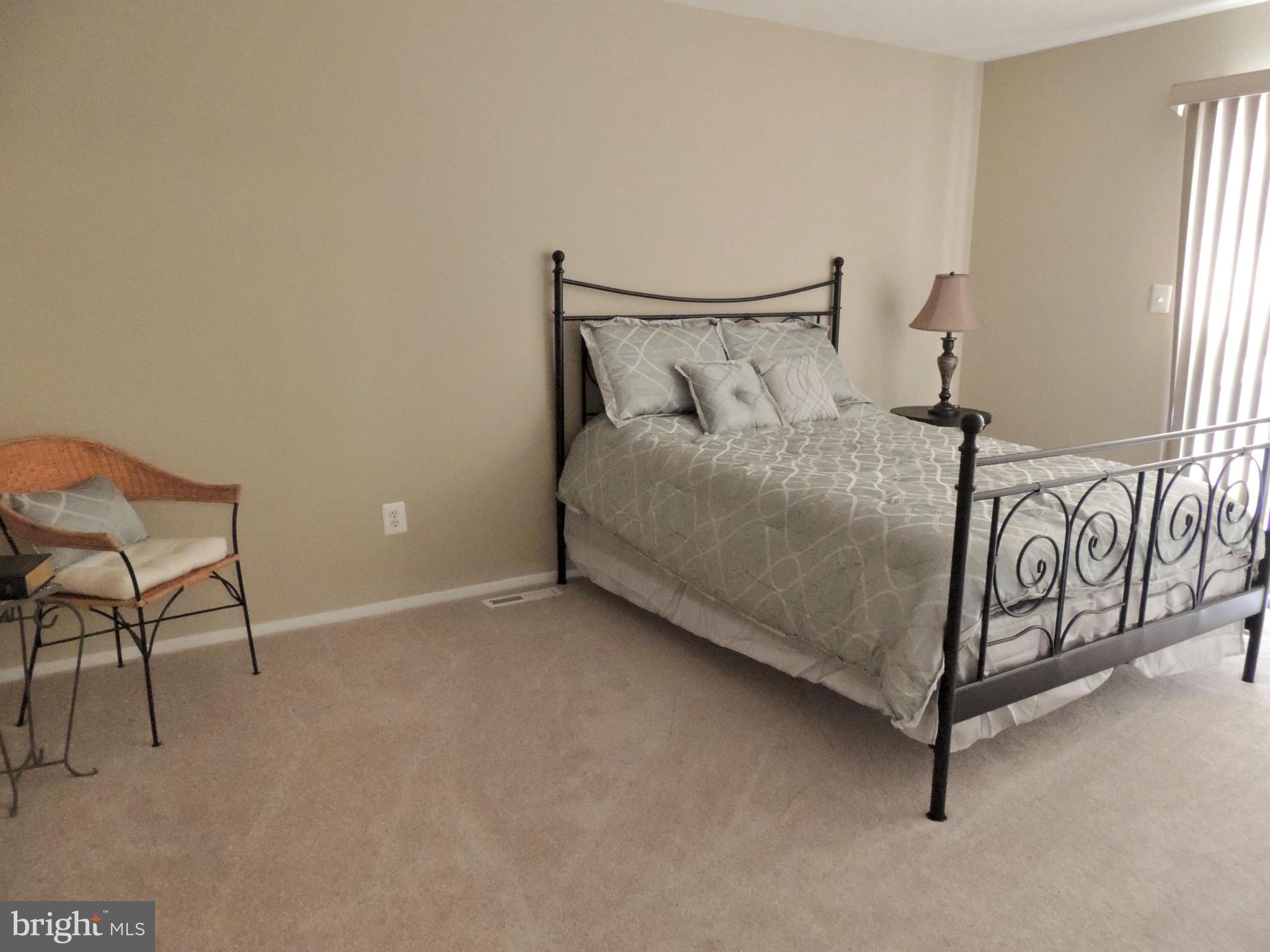 4803 Ebenezer Road Nottingham, MD 21236 - Photo 28 of 29 a bedroom with a bed and a window