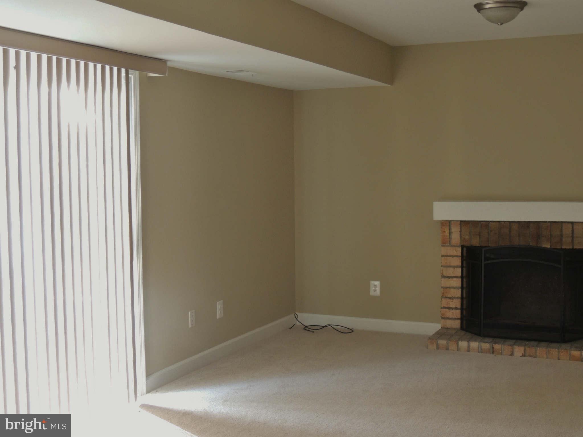 4803 Ebenezer Road Nottingham, MD 21236 - Photo 7 of 29 a view of an empty room with a fireplace