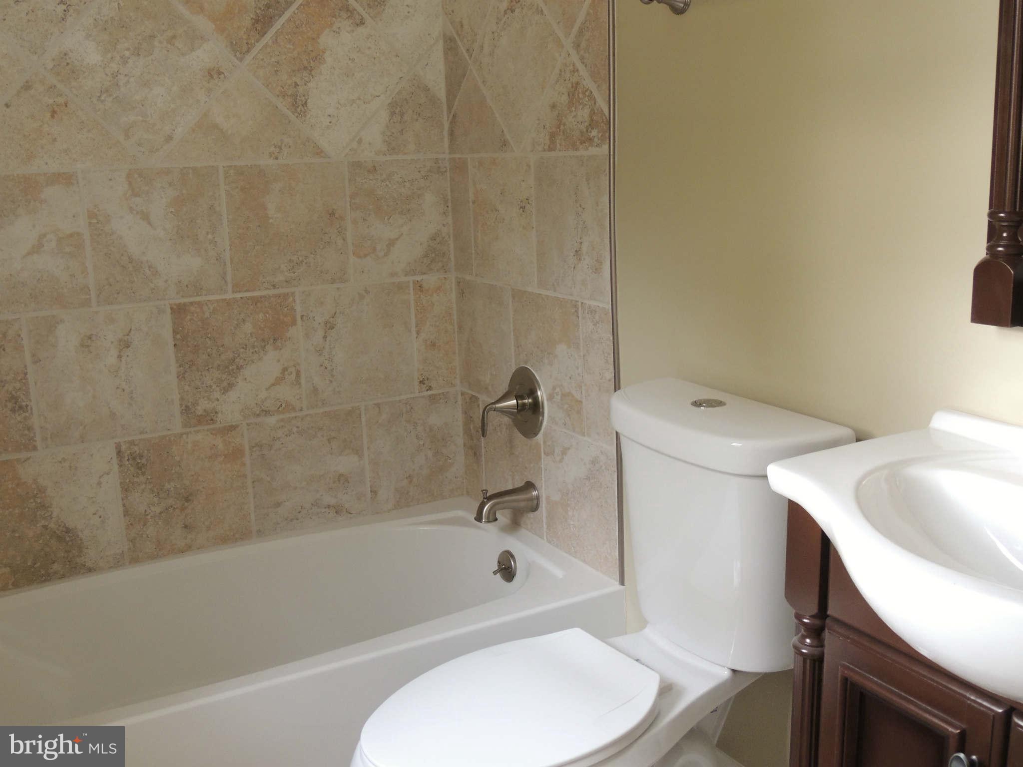 4803 Ebenezer Road Nottingham, MD 21236 - Photo 8 of 29 a bathroom with a sink and a toilet