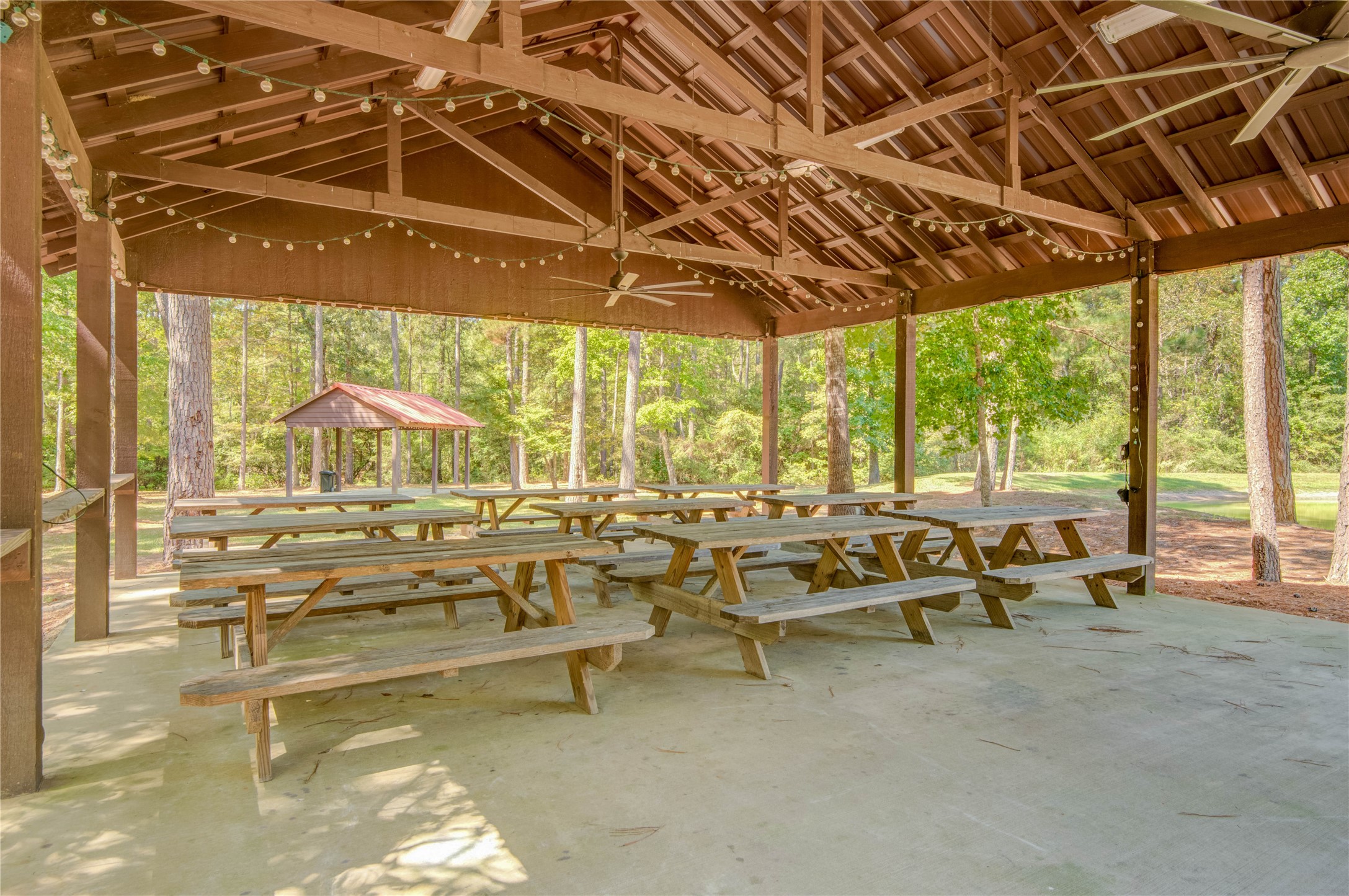 185 Rim Rock Road Huntsville, TX 77340 - Photo 13 of 19 a living room with lots of furniture and a chandelier