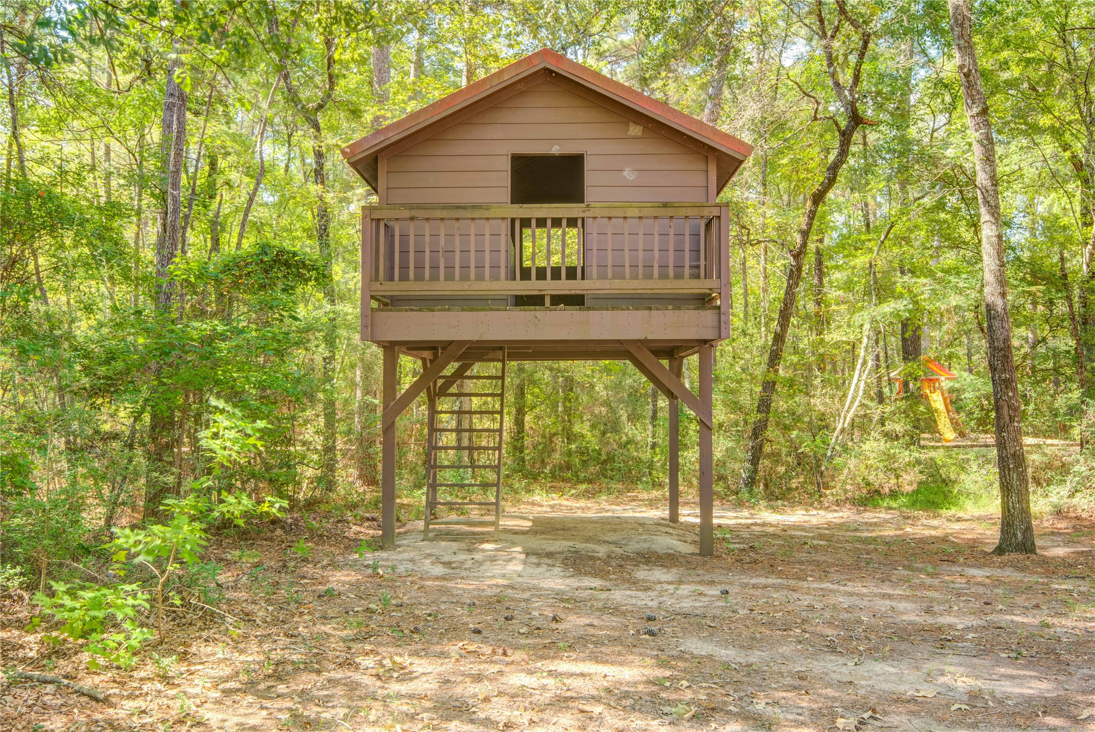 185 Rim Rock Road Huntsville, TX 77340 - Photo 16 of 19 a front view of a house with a garden