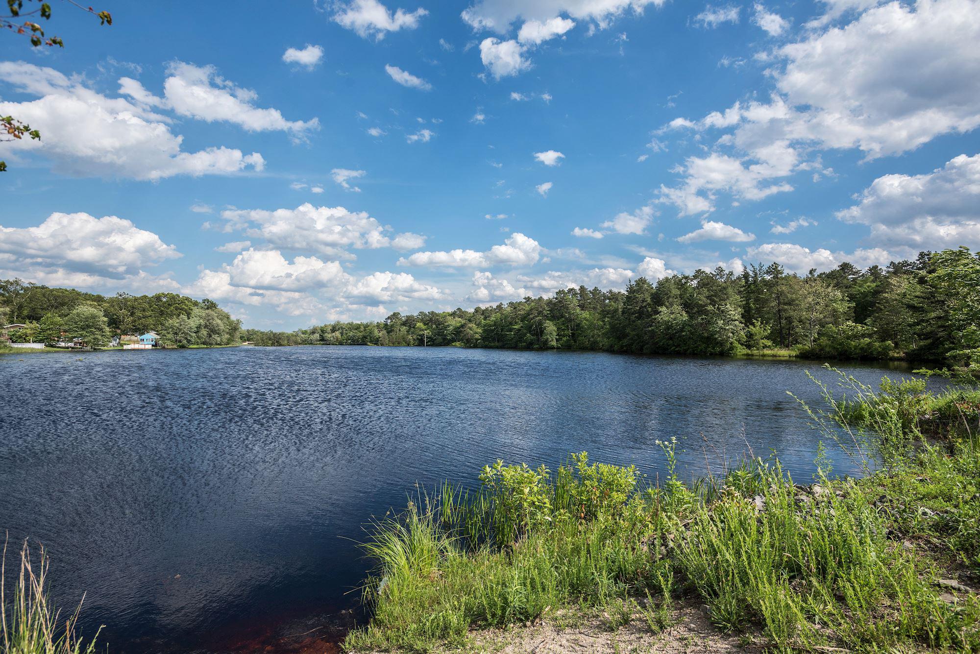 603 New Jersey Road Browns Mills, NJ 08015 - Photo 26 of 28 Tranquil waters under a blue sky.