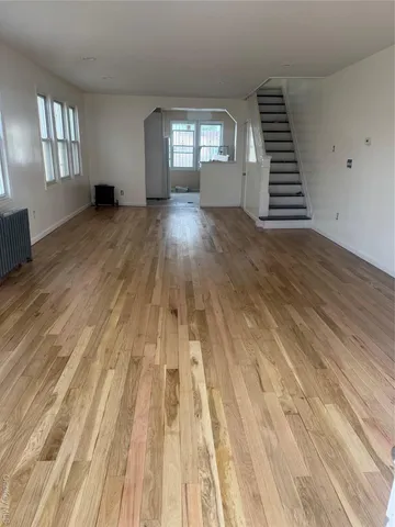 wooden floor in a room with a window