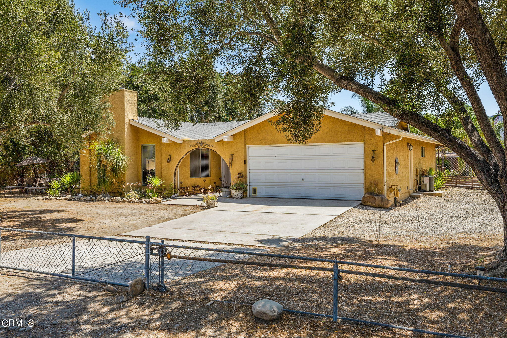 52 Grapevine Road Oak View, CA 93022 - Photo 2 of 52 a backyard of a house with table and chairs