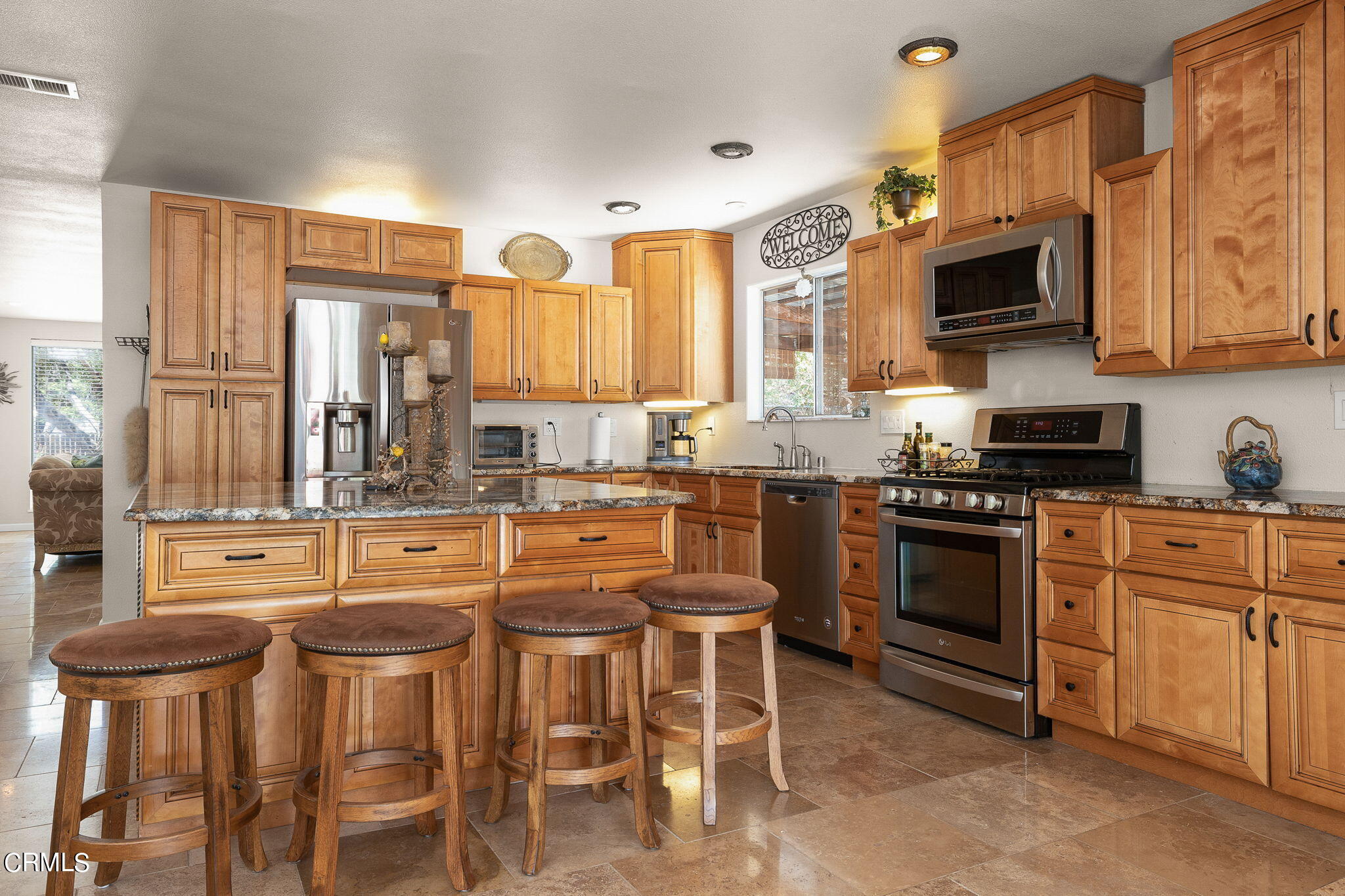 52 Grapevine Road Oak View, CA 93022 - Photo 13 of 52 a kitchen with stainless steel appliances granite countertop a stove a sink dishwasher and a microwave oven with cabinets