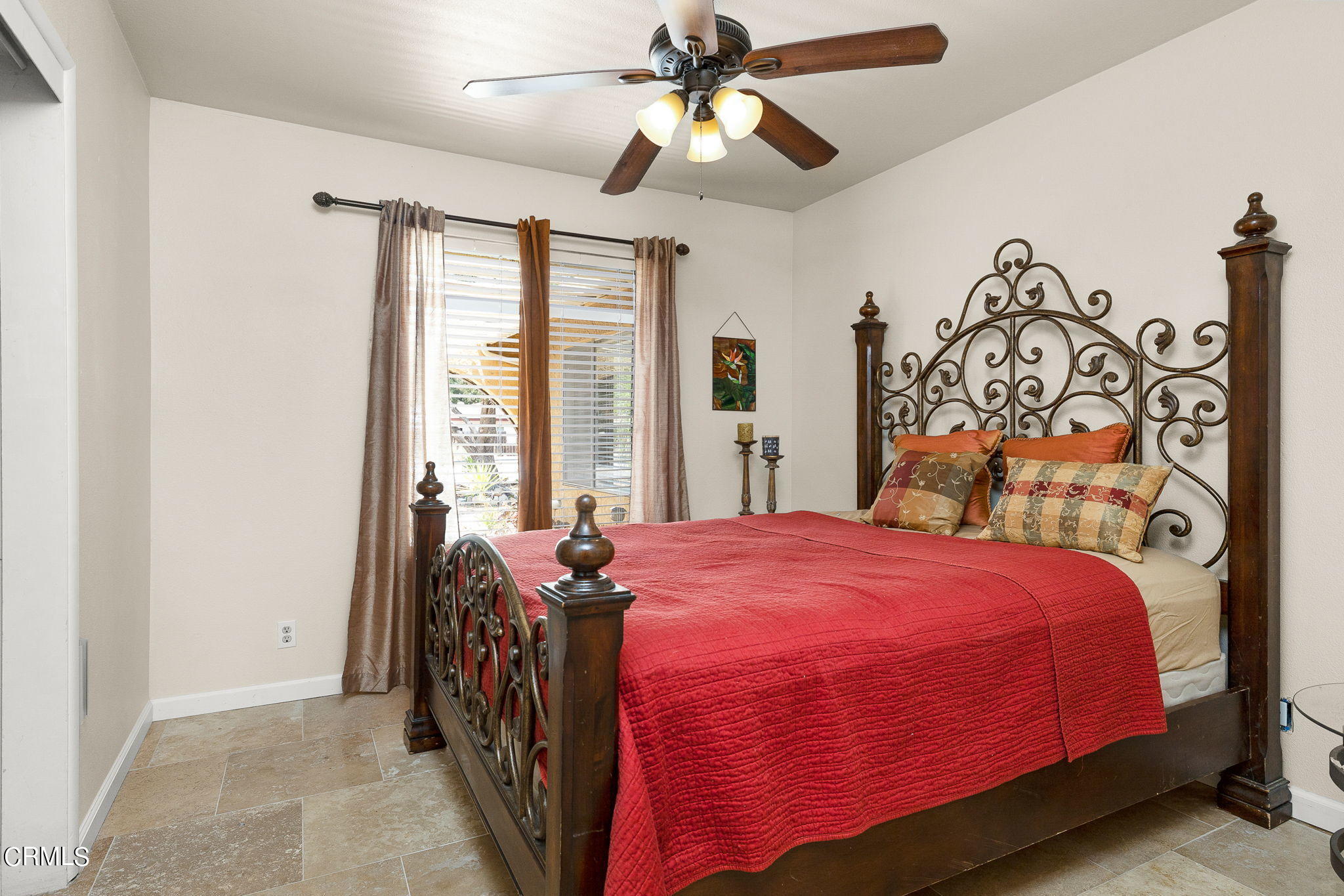 52 Grapevine Road Oak View, CA 93022 - Photo 18 of 52 a bedroom with a bed and a chandelier