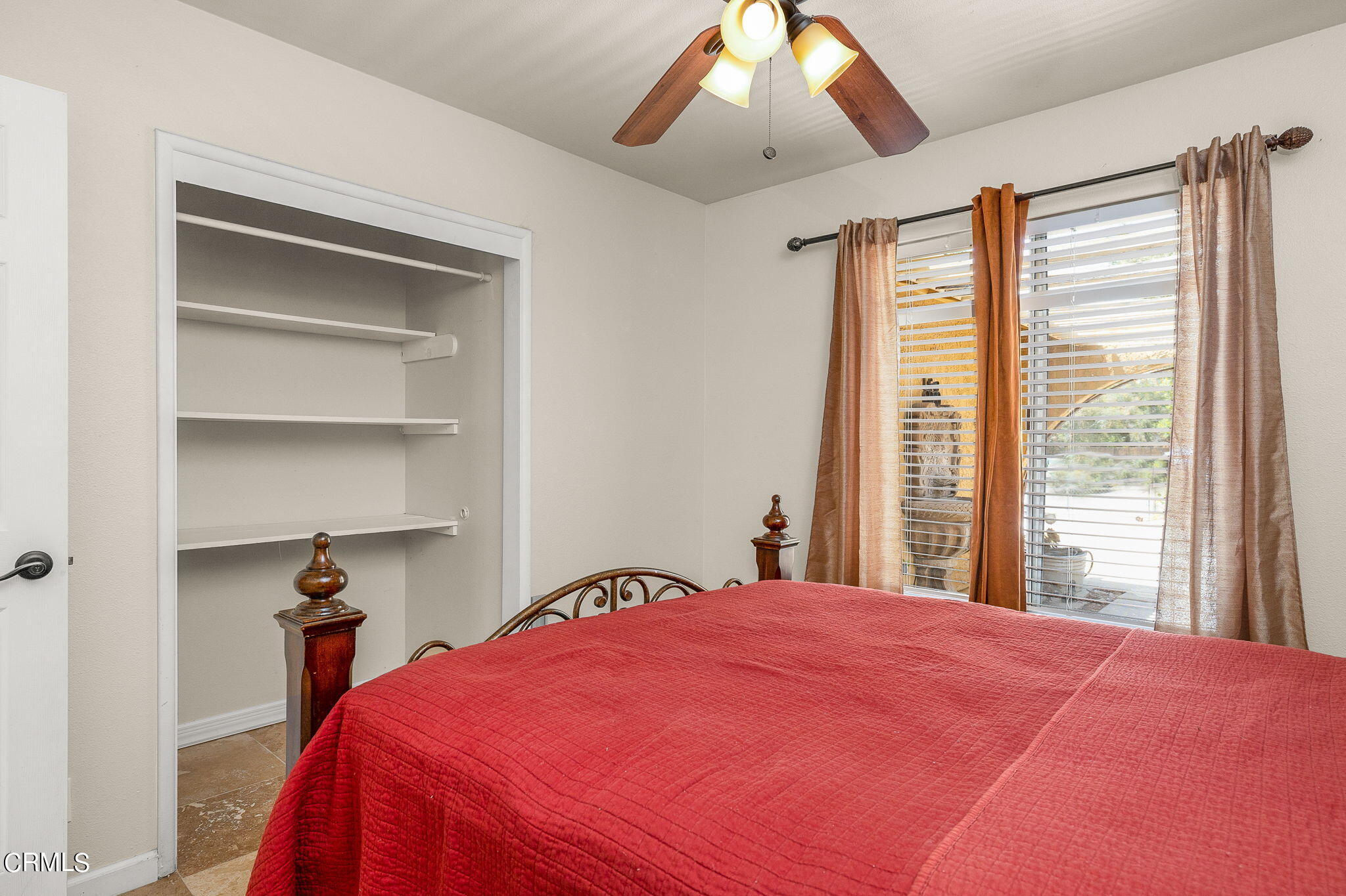 52 Grapevine Road Oak View, CA 93022 - Photo 19 of 52 a bedroom with a large bed and a chandelier