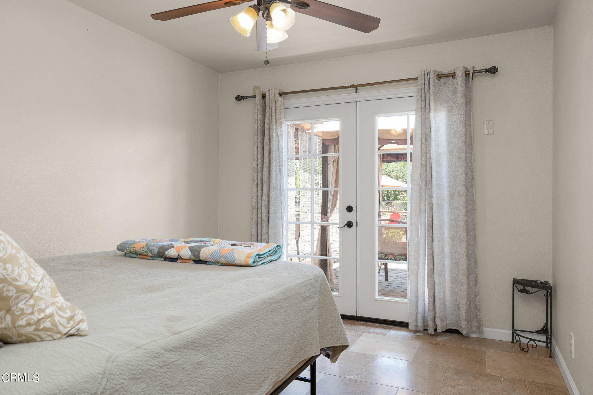 52 Grapevine Road Oak View, CA 93022 - Photo 21 of 52 a bedroom with a bed and a chandelier