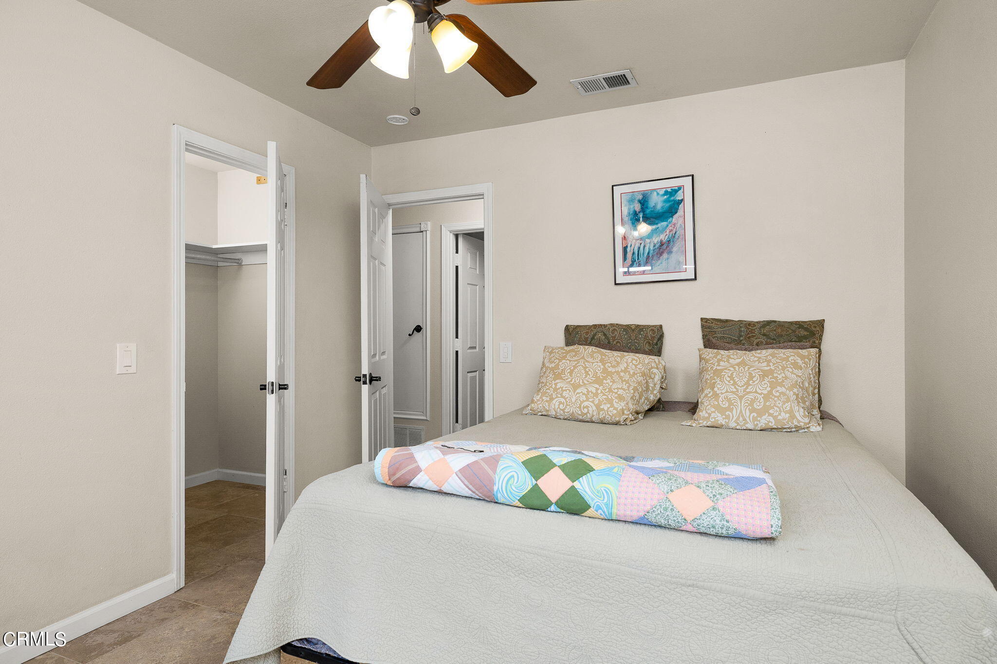 52 Grapevine Road Oak View, CA 93022 - Photo 22 of 52 a bedroom with a large bed and a chandelier