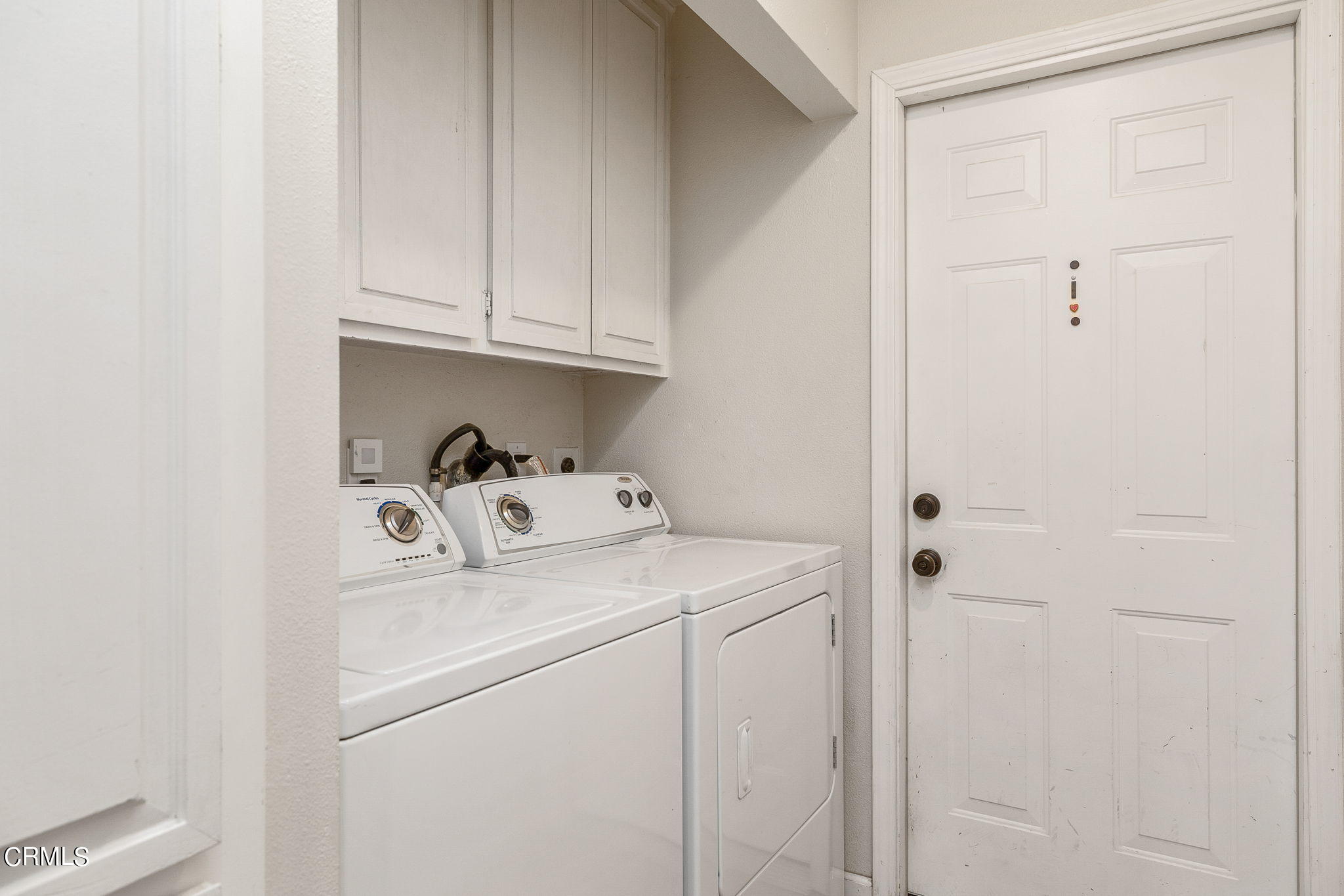 52 Grapevine Road Oak View, CA 93022 - Photo 23 of 52 a utility room with dryer and washer