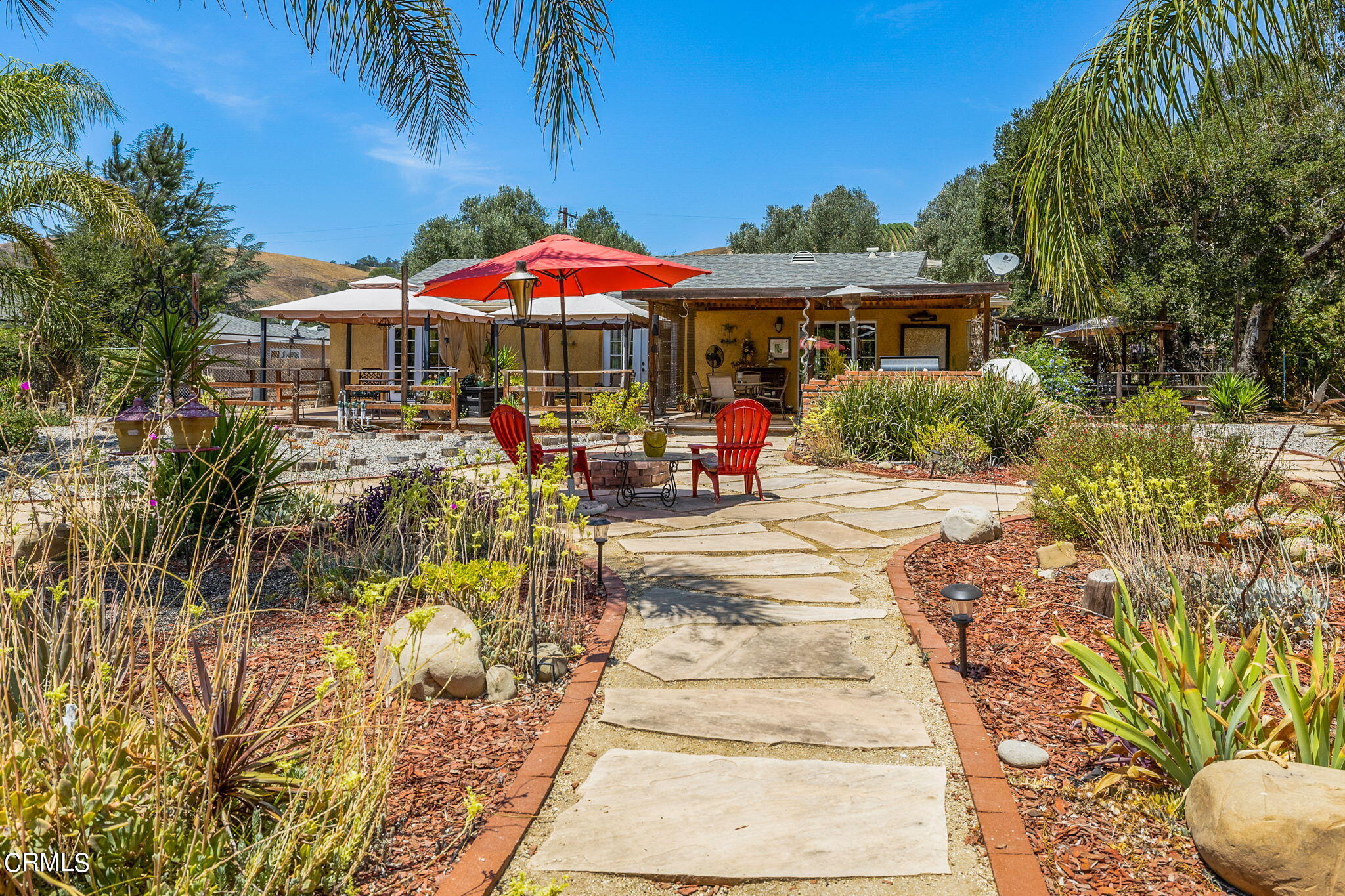 52 Grapevine Road Oak View, CA 93022 - Photo 25 of 52 a front view of a house with yard and sitting area