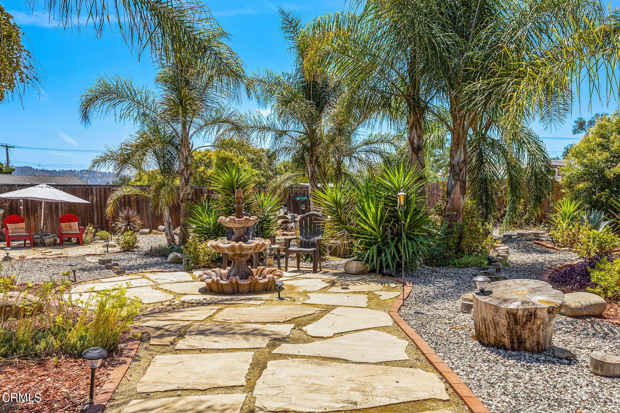 52 Grapevine Road Oak View, CA 93022 - Photo 30 of 52 a view of the patio with a table and chairs under a umbrella