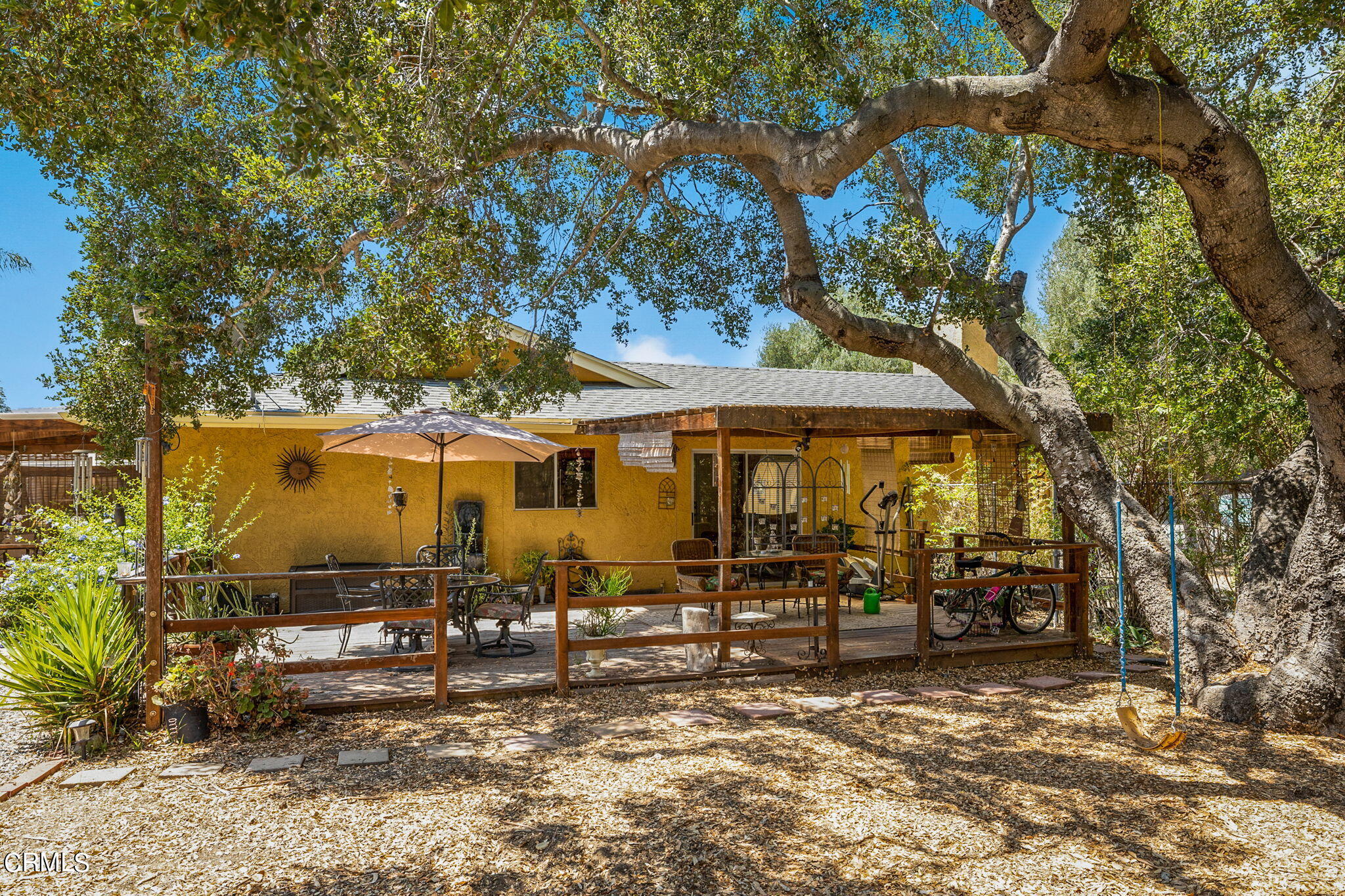 52 Grapevine Road Oak View, CA 93022 - Photo 36 of 52 a view of a house with a large tree and a yard