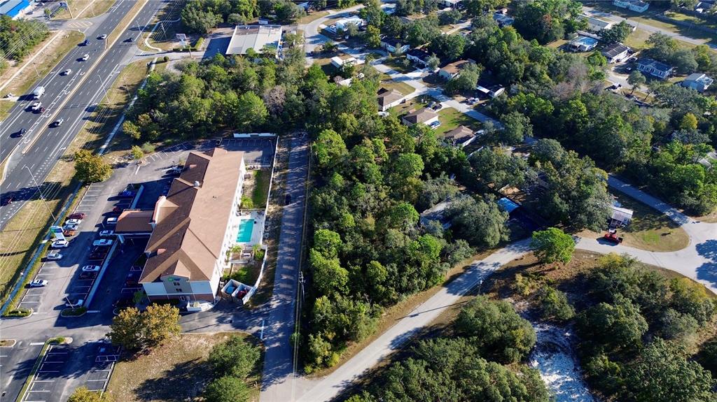 3560 Diagonal Lane Spring Hill, FL 34606 - Photo 5 of 12 an aerial view of residential house with outdoor space and trees