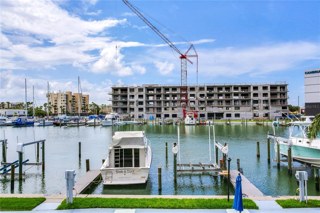 171 Medallion Boulevard, Unit H Madeira Beach, FL 33708 - Photo 37 of 44 a view of a lake in middle of a lake view