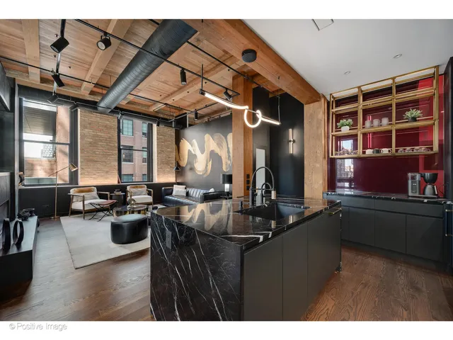 a kitchen with a table chairs stove and cabinets