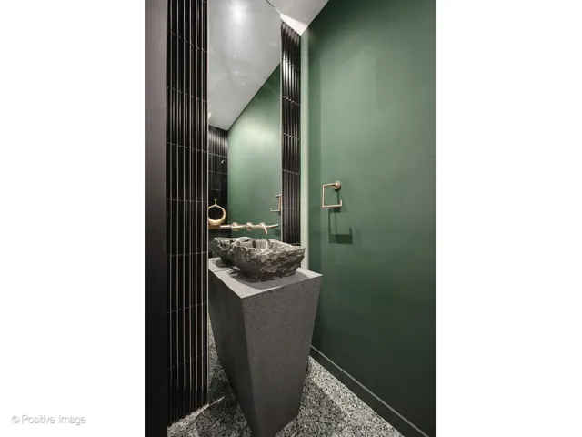 a picture of a bathroom with a sink and mirror