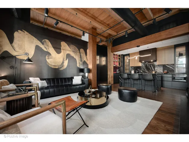 a living room with furniture a rug and a fireplace