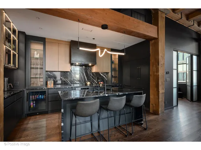 a kitchen with a table and chairs in it