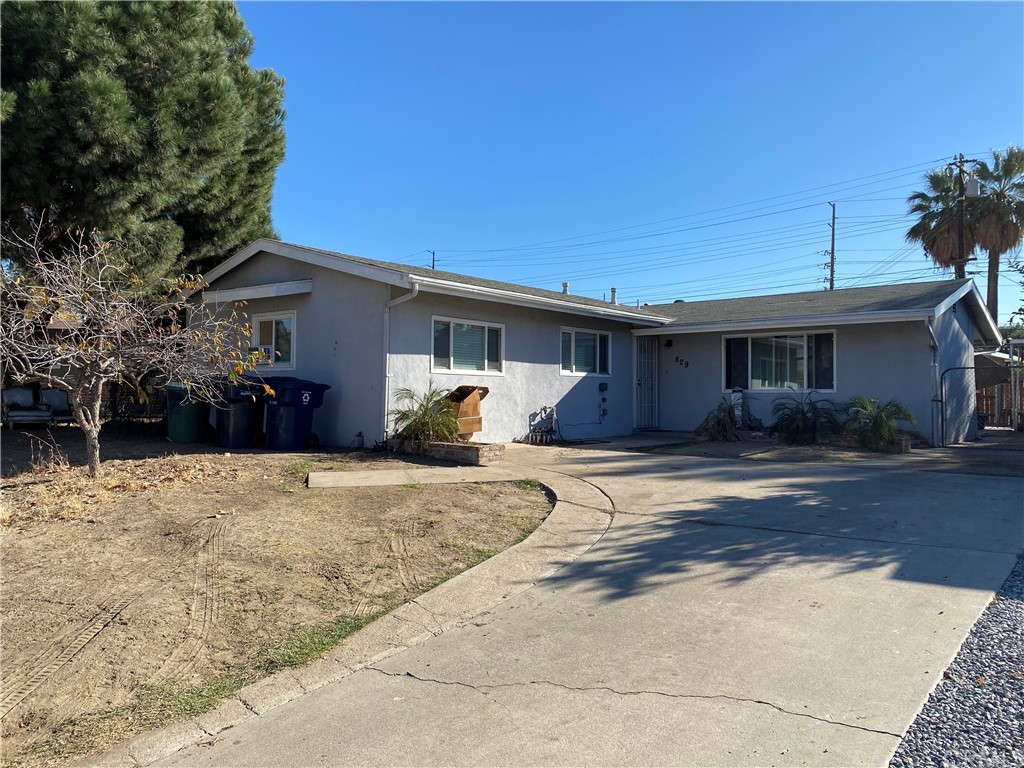 829 West Sharon Road Redlands, CA 92374 - Photo 1 of 1 a front view of a house with a yard and garage