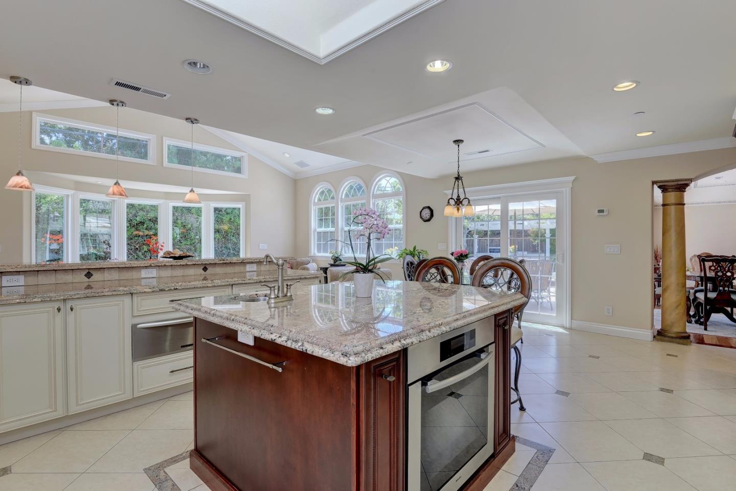 1042 Celilo Drive Sunnyvale, CA 94087 - Photo 11 of 27 a kitchen with stainless steel appliances granite countertop a stove and a sink