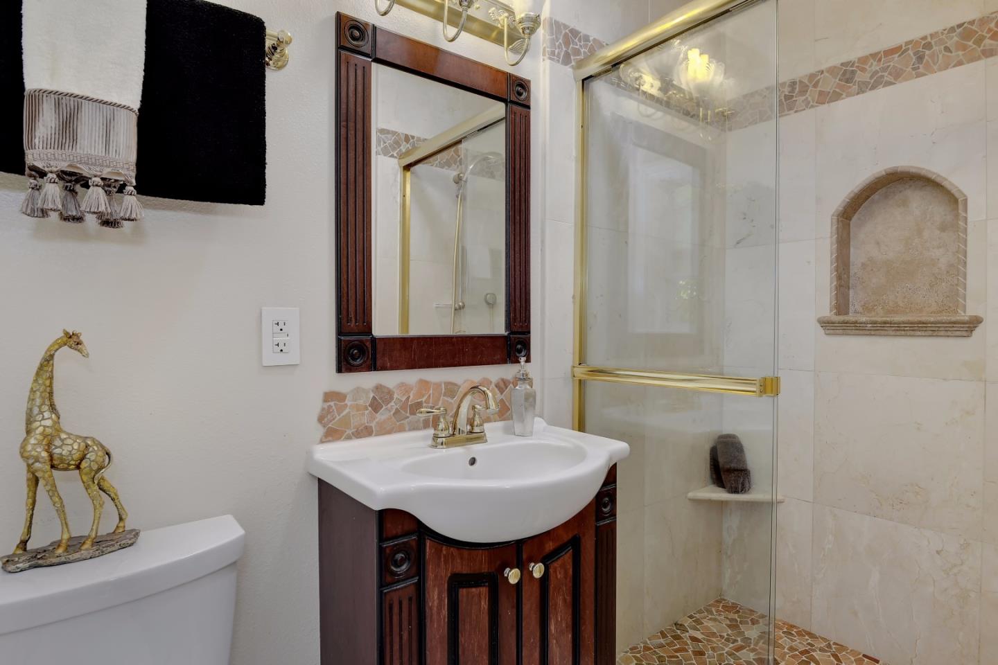 1042 Celilo Drive Sunnyvale, CA 94087 - Photo 16 of 27 a bathroom with a sink toilet and shower
