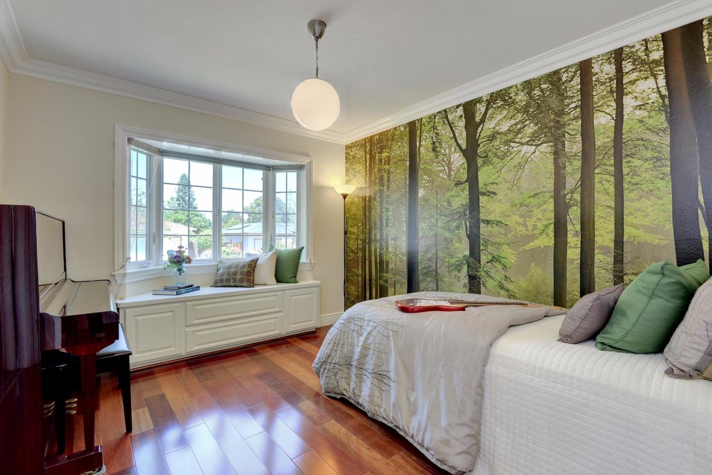 1042 Celilo Drive Sunnyvale, CA 94087 - Photo 17 of 27 a bedroom with a large bed and a large window