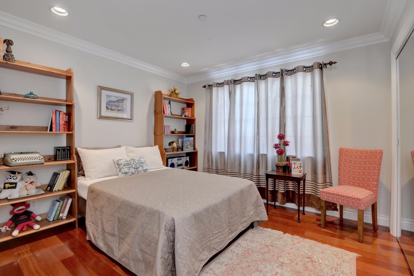 1042 Celilo Drive Sunnyvale, CA 94087 - Photo 21 of 27 a bedroom with a bed and a chair in it