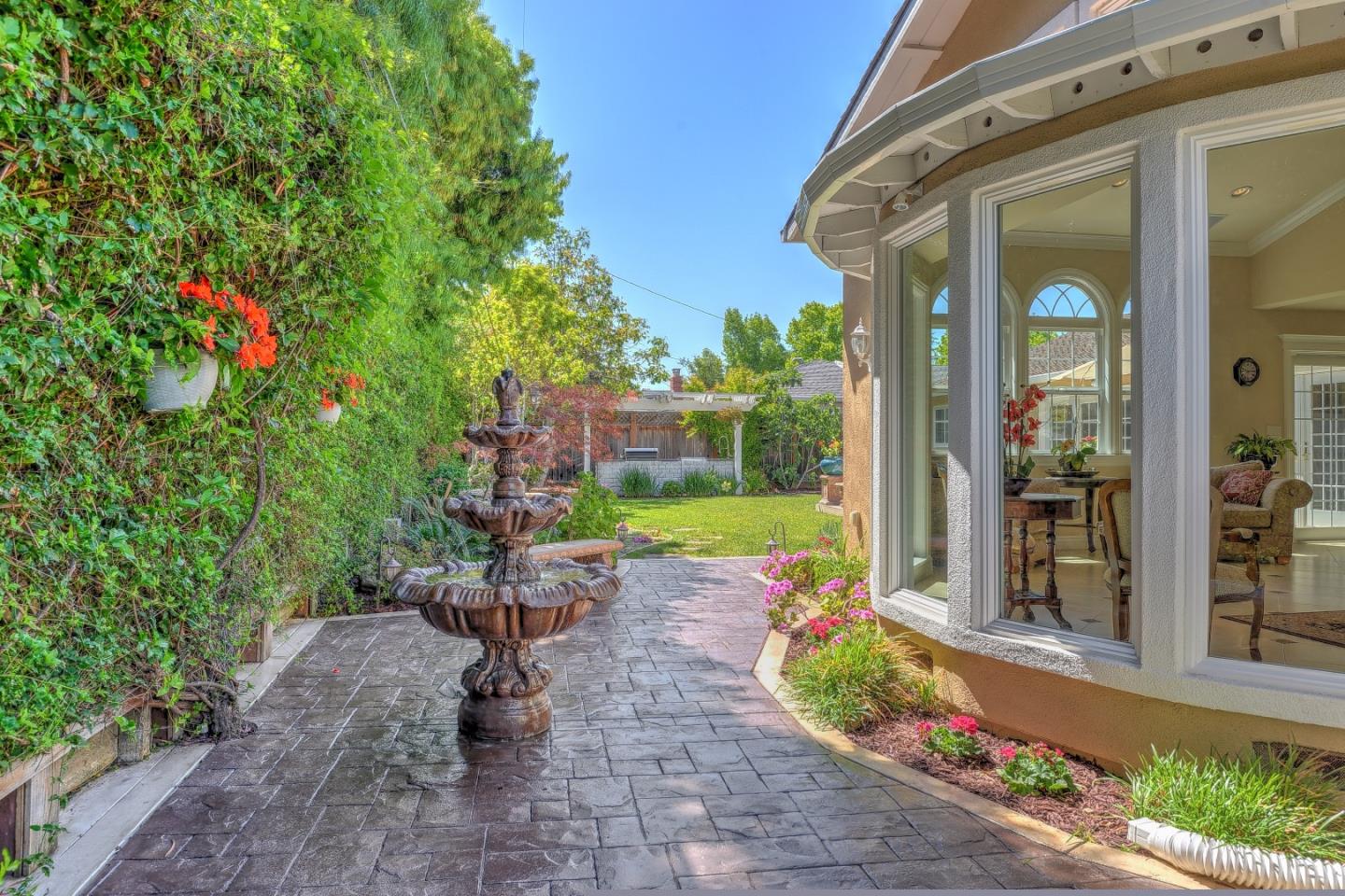 1042 Celilo Drive Sunnyvale, CA 94087 - Photo 24 of 27 a front view of a house with a yard