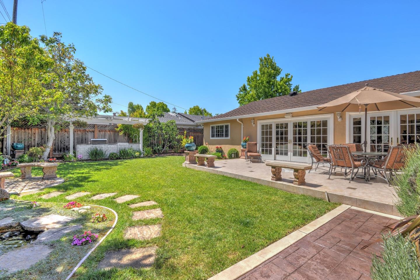 1042 Celilo Drive Sunnyvale, CA 94087 - Photo 26 of 27 a house view with swimming pool and garden space