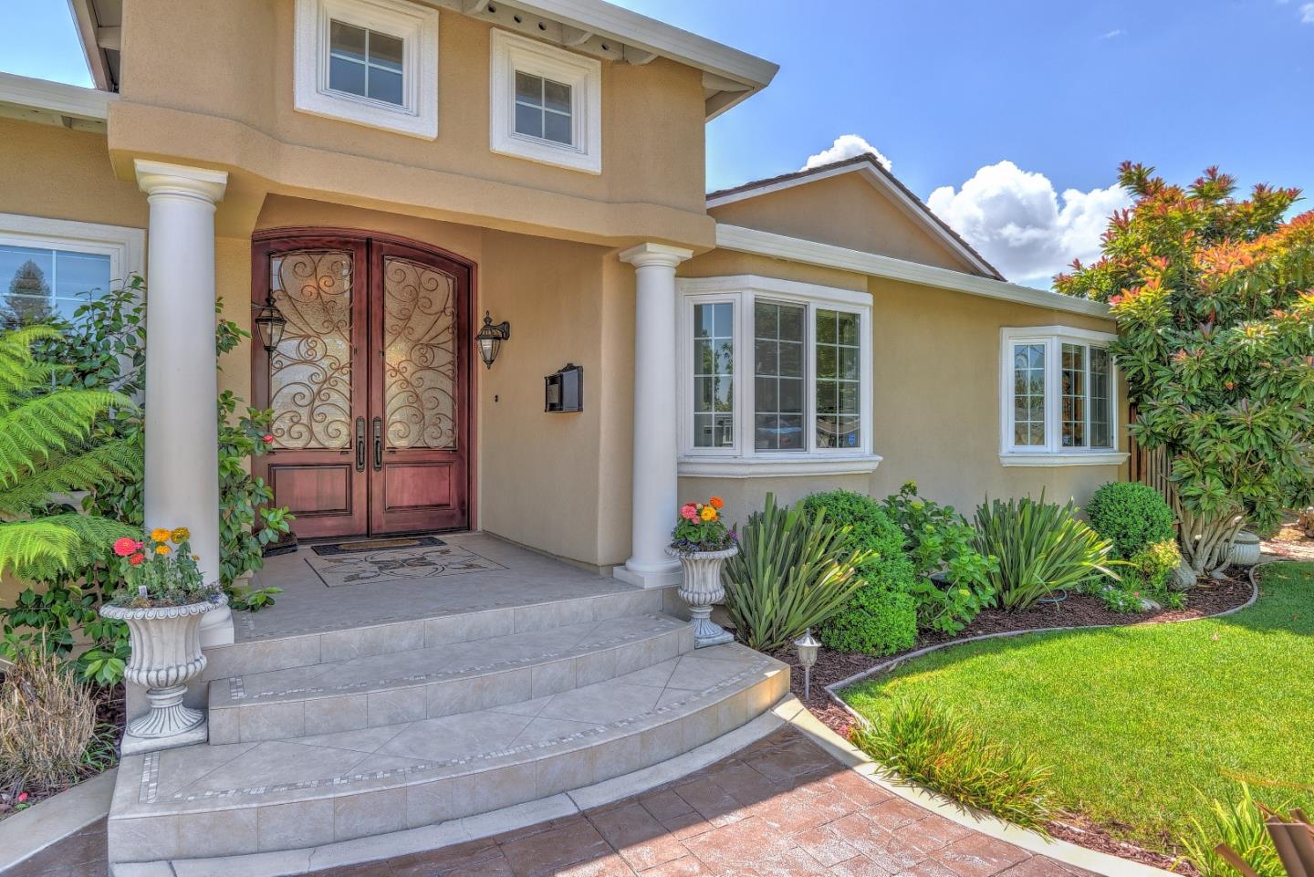 1042 Celilo Drive Sunnyvale, CA 94087 - Photo 3 of 27 a front view of a house with garden
