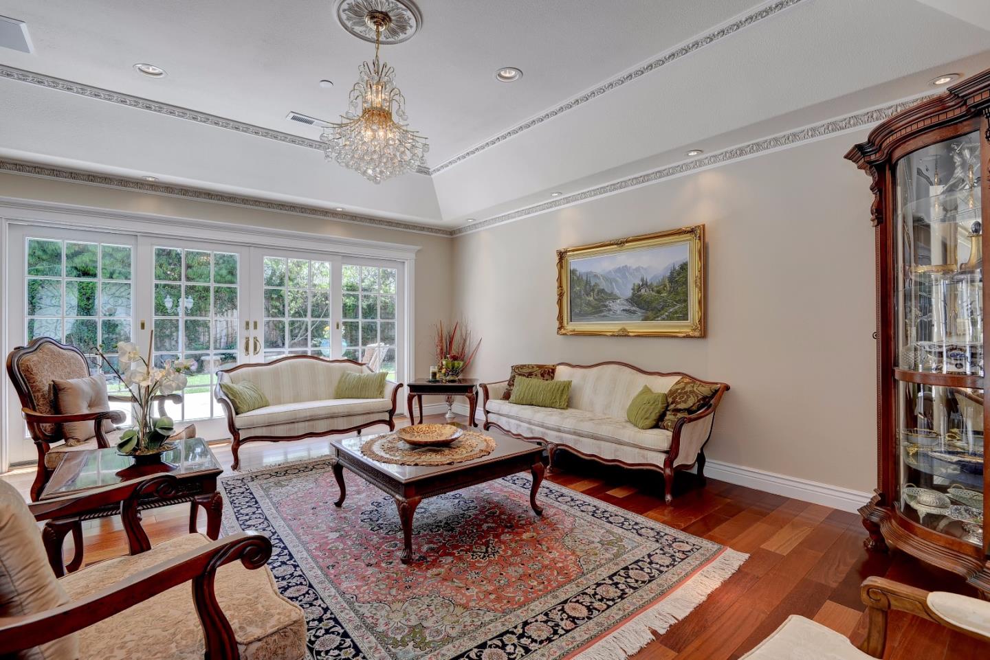 1042 Celilo Drive Sunnyvale, CA 94087 - Photo 5 of 27 a living room with furniture a rug and a chandelier
