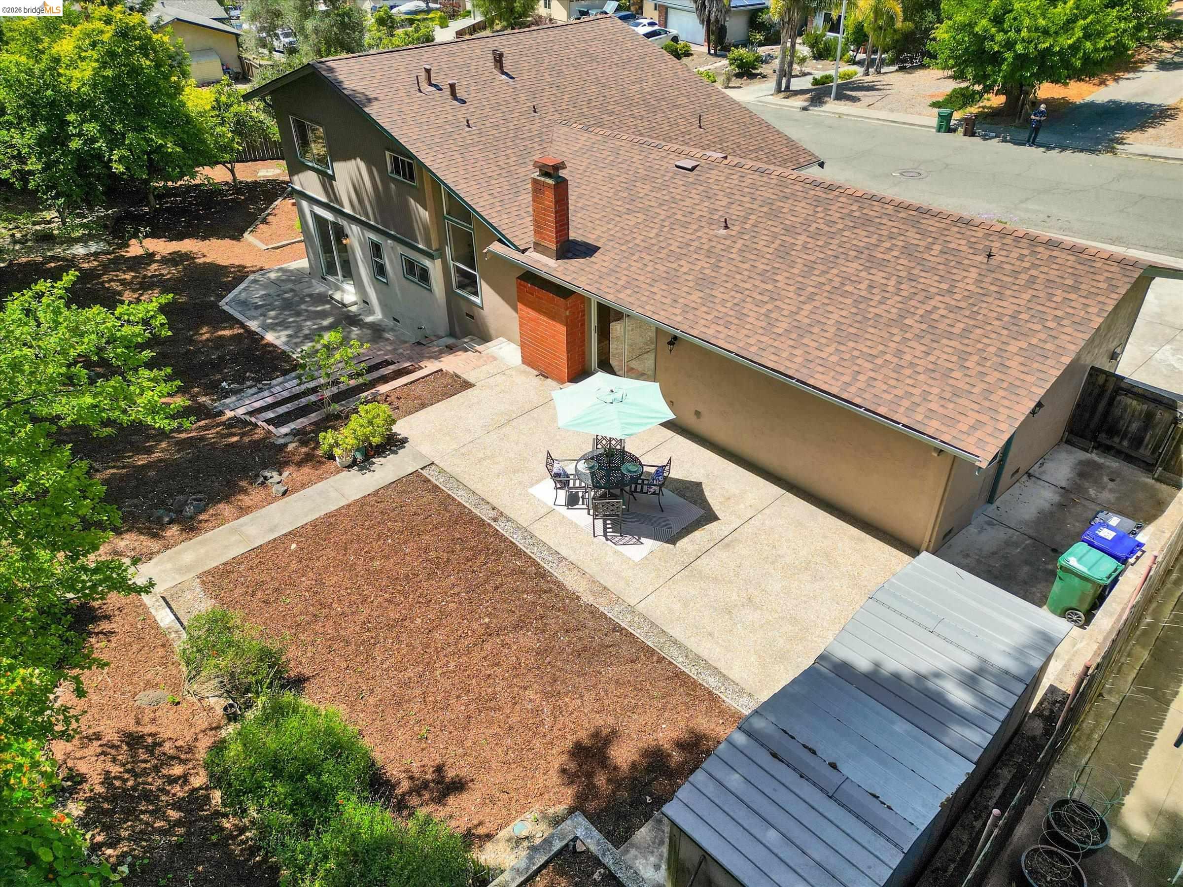 2826 Wright Avenue Pinole, CA 94564 - Photo 61 of 70 Exterior featuring a shingle roof, a brick chimney, and a concrete patio