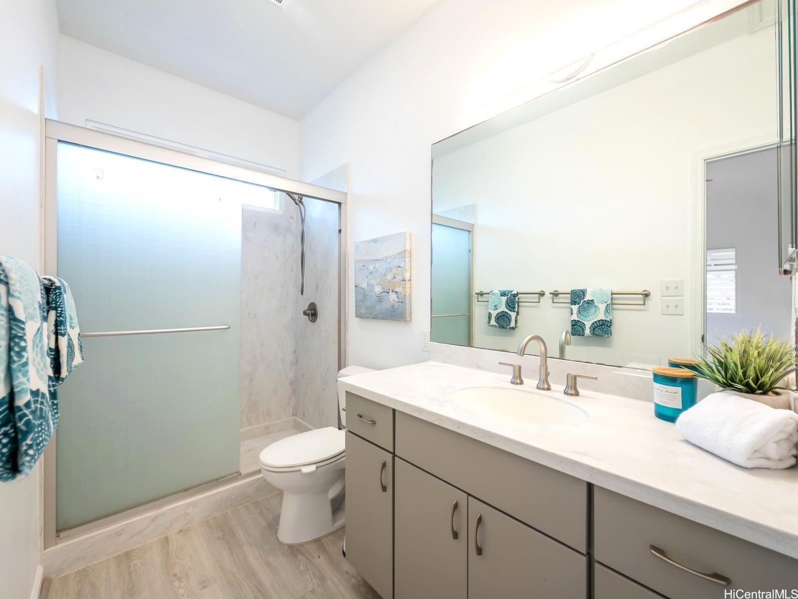 45-185 Lilipuna Road, Unit A Kaneohe, HI 96744 - Photo 12 of 22 a bathroom with a sink a toilet and shower