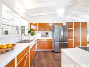 45-185 Lilipuna Road, Unit A Kaneohe, HI 96744 - Photo 17 of 22 a kitchen with stainless steel appliances granite countertop a sink a refrigerator and a stove