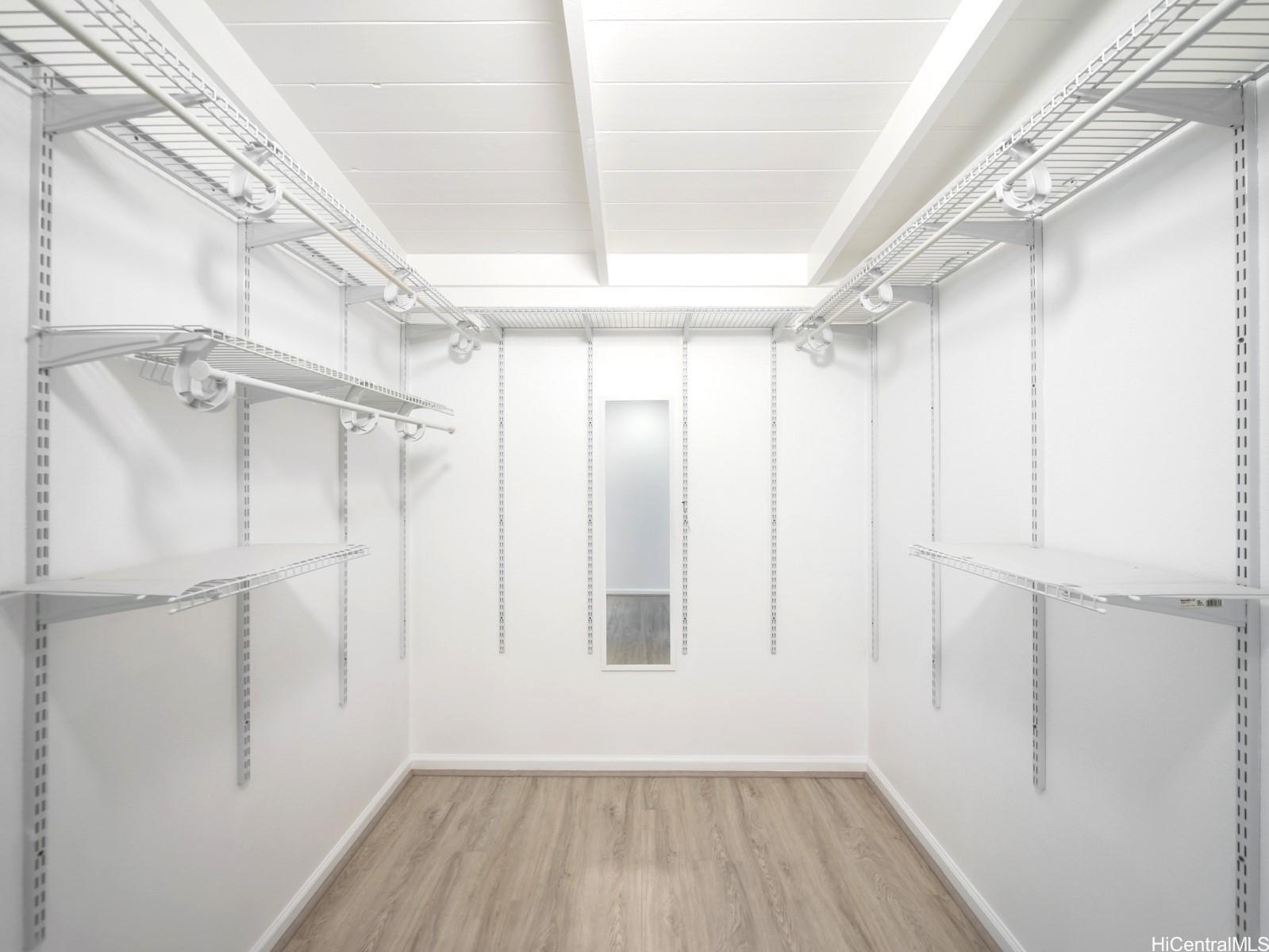 45-185 Lilipuna Road, Unit A Kaneohe, HI 96744 - Photo 18 of 22 a view of a room with wooden floor and window