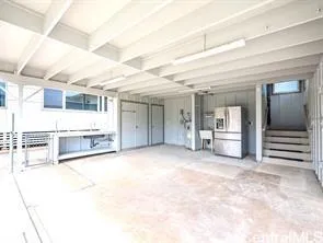 a view of a house with backyard and a garage