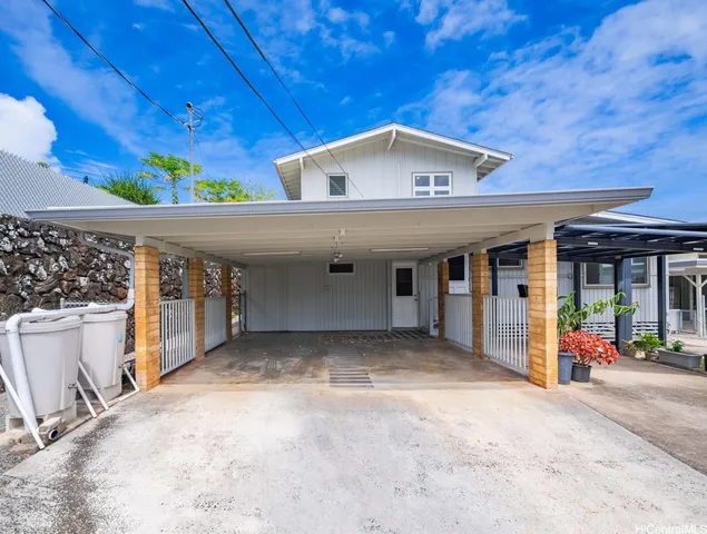 a view of a backyard with wooden fence