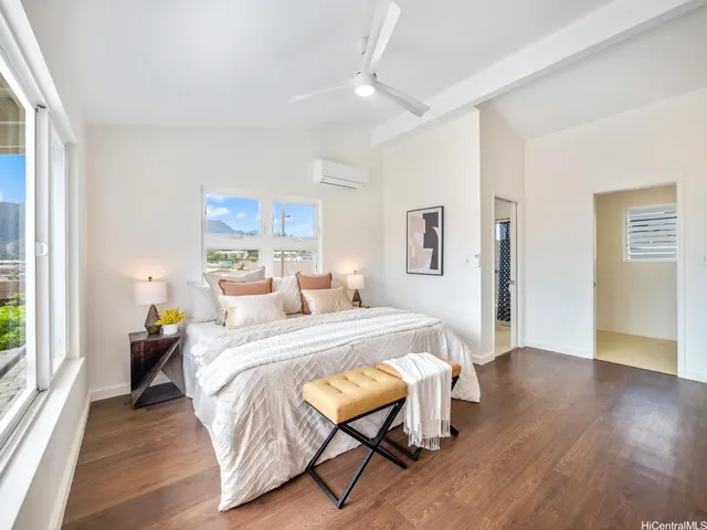 a bed room with a bed and a chair