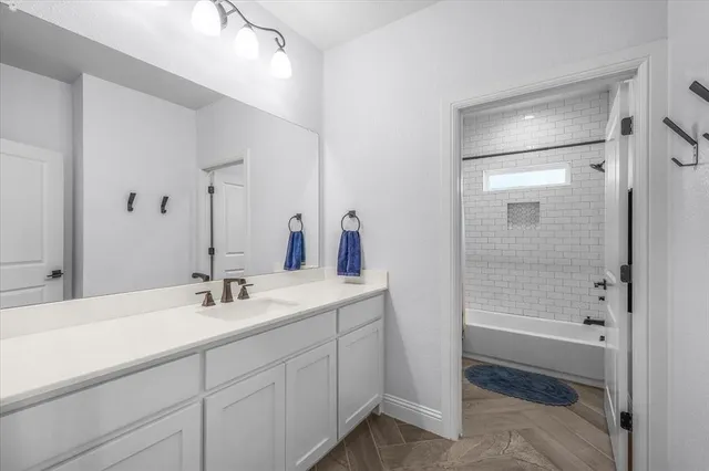 a utility room with sink dryer and washer