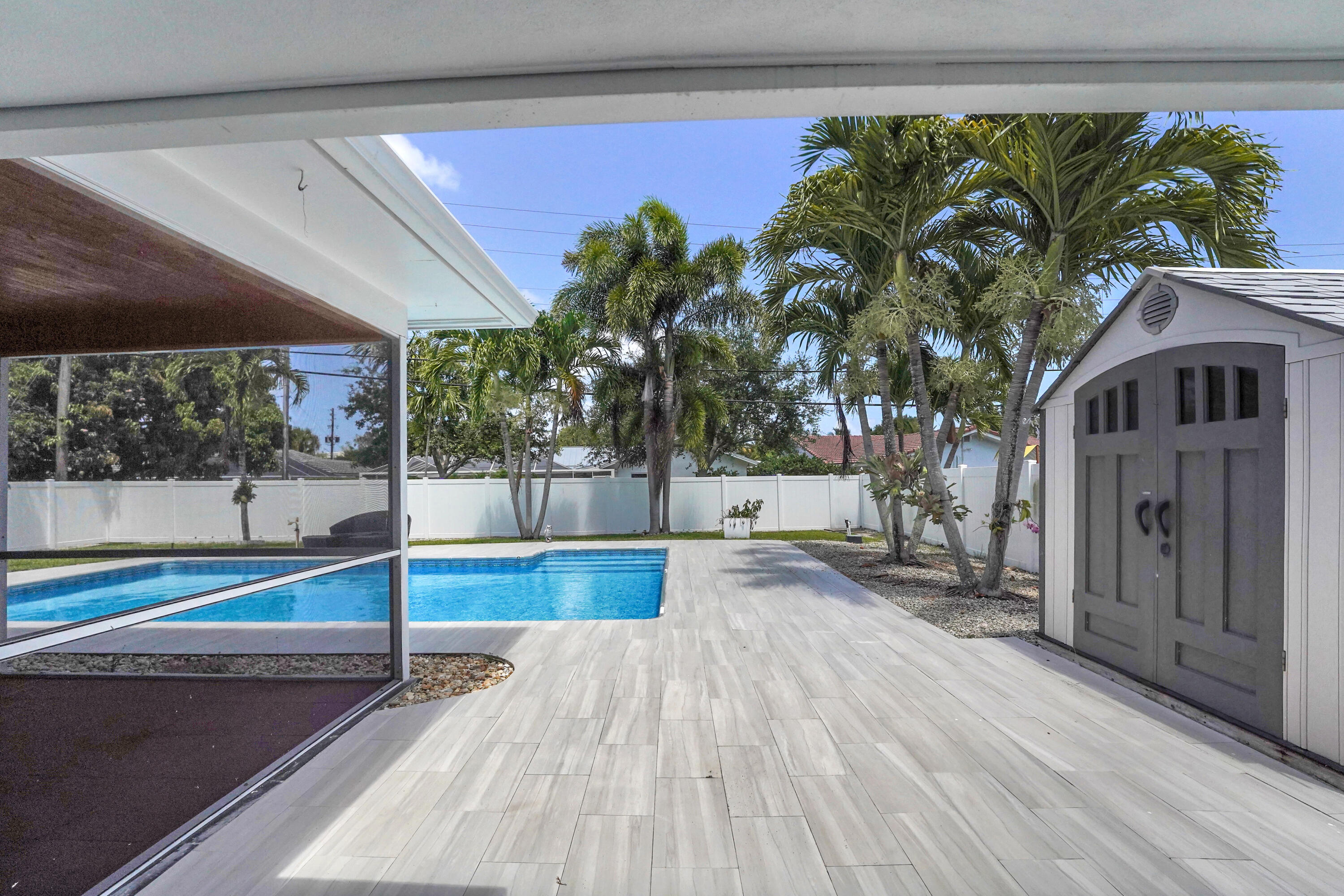 600 Northwest 12th Avenue Boca Raton, FL 33486 - Photo 19 of 63 a view of a house with a swimming pool