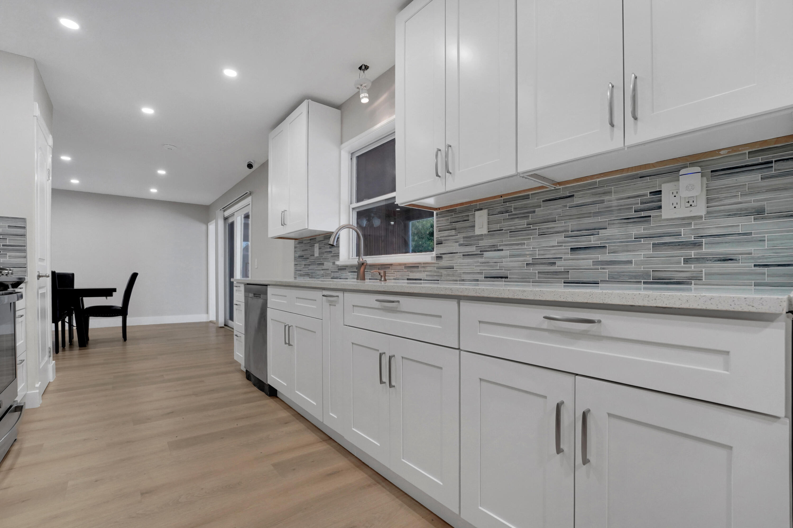 600 Northwest 12th Avenue Boca Raton, FL 33486 - Photo 20 of 63 a kitchen with cabinets appliances and a counter space